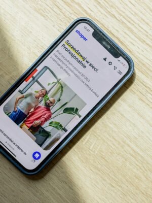 Smartphone displaying an ecommerce website. Optimize online sales and presence.